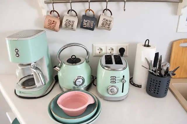 Coffee maker, kettle and toaster in the kitchenette