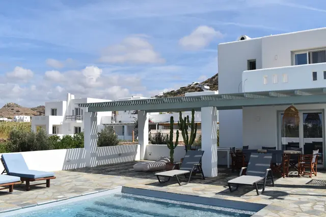 White Cycladic villa and shaded pergola