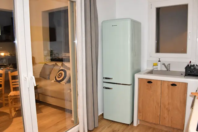 Private kitchenette with wooden cabinetry