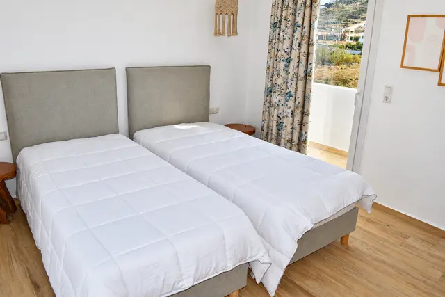 Twin bedroom with upholstered headboards