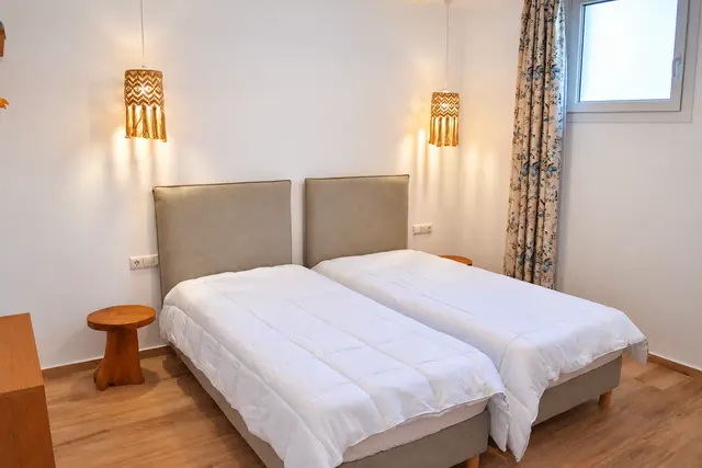 Twin bedroom with upholstered headboards
