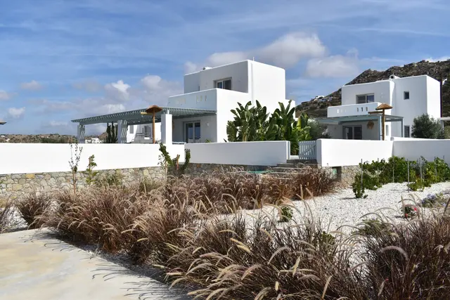 Cycladic villa surrounded by garden planting