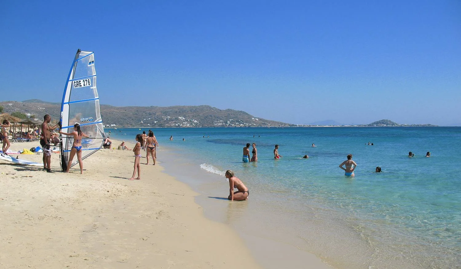 Clear turquoise water and fine sand at Plaka Beach, Naxos
