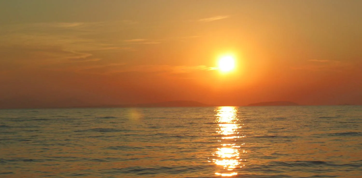 Golden sunset over the Aegean Sea at Plaka